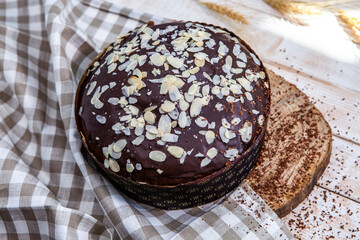 Panettone is the traditional Italian dessert for easter in 2021. Homemade panettone covered in chocolate. Sweet Bread served as dessert.