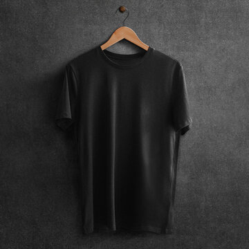Black t-shirt on a hanger with copy space
