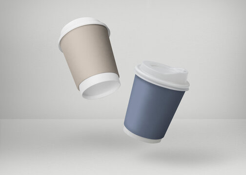 Coffee cups in blue and gold on white backdrops