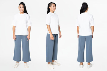 Woman in white tee and blue loose pants minimal fashion