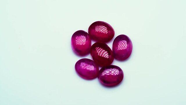 natural red rhodolite gemstone on the turning table
