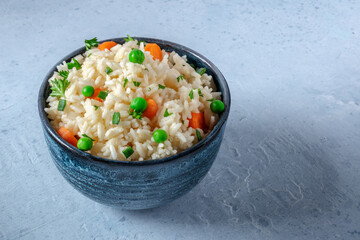 Vegetable rice in a blue bowl