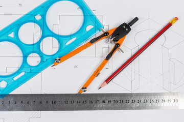 Tools for draftsmanship lie on a training drawing