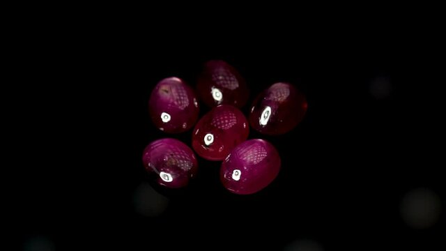 natural red rhodolite gemstone on the turning table