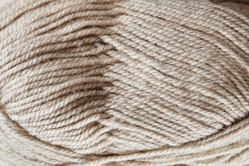 Skein of woolen yarn on wooden background