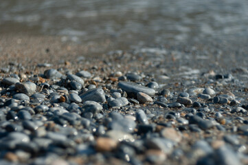 Tracing stones on the beach near the sea