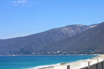 Obraz premium View from the embankment to the sea and mountains. Gagra, Abkhazia