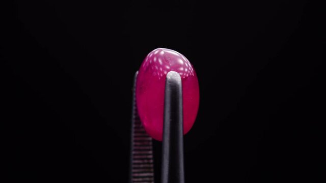 natural red rhodolite gemstone on the turning table