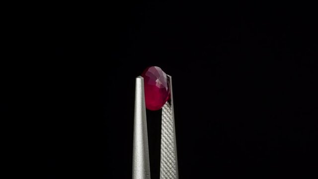 natural red rhodolite gemstone on the turning table