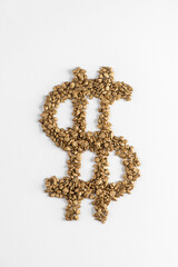 US Dollar sign made from golden pieces on white background