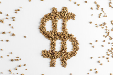 Top view on dollar sign made from golden pieces