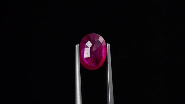natural red rhodolite gemstone on the turning table