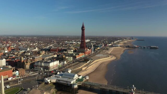 4K: Aerial Drone Video of The Blackpool Tower, England, UK. Flying down the Coast towards the landmark. Stock Video Clip Footage