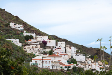 Fototapeta na wymiar White houses of the town of Agaete on the mountainside on the island of Gran Canaria, Spain