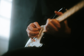 man playing an electric guitar on stage