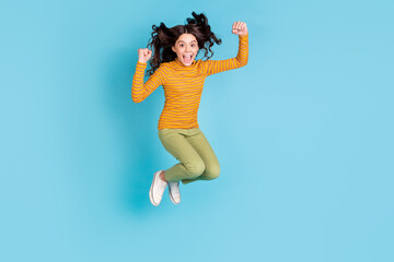 Full size photo of carefree delighted girl open mouth scream yeah unbelievable isolated on blue...