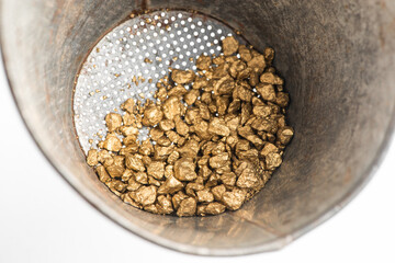 View inside of the sieve with golden nuggets