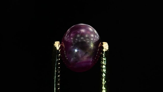natural star ruby gemstone on the turning table