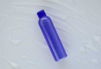 Lavender liquid, shampoo. Bath cosmetics on a white background. Natural spa products. The concept of beauty.