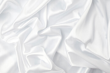 Creases of white satin, silk, and cotton. Abstract white fabric texture background. Cloth soft wave