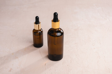 Eco Mineral oil in Amber glass bottles with pipette. Transparent hyaluronic serum gel and skin care concept. Top horizontal view copyspace of dropper glass.