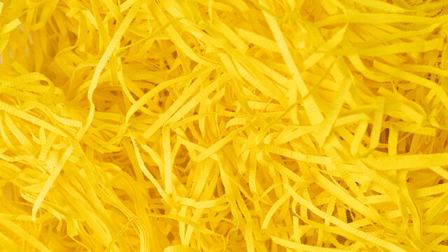 close up macro image yellow paper shavings