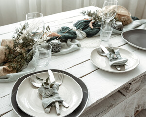 Stylish table setting for two with decor details.