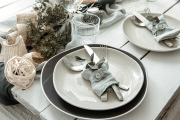 Stylish table setting for two with decor details.