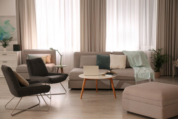 Stylish living room interior with comfortable sofa
