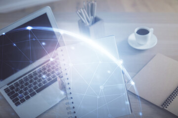 Double exposure of woman hands typing on computer and social network theme hologram drawing. People...