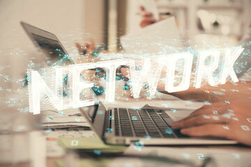 Multi exposure of woman hands working on computer and data theme hologram drawing. Tech concept.
