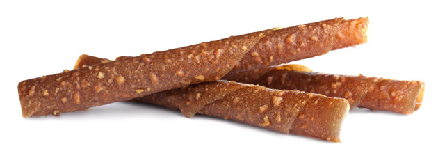 Delicious fruit leather rolls on white background