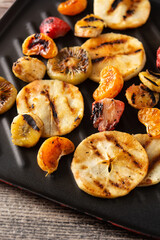 Grilled fruit in the iron pan.Close up