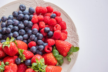 fresh ripe juicy wild berries raspberries and blueberries