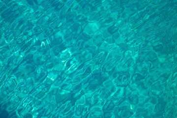 Sea water clear background. Bright turquoise water aqua texture. Vacations summer mood concept