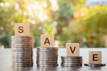 The word "SAVE" on the coin pile is placed alternately high. Business investment ideas, economic income, security, financial risks, taxes. Saving.