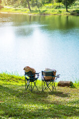 Two chairs Camping near lake. Outdoor travel, trip and vacation concept