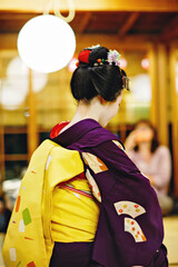 Maiko apprentice showing Japanese traditional dance. Maiko is an apprentice geisha. Maikos...