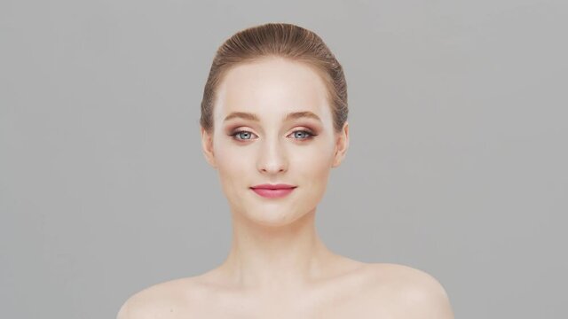Studio portrait of young, beautiful and natural woman. Face lifting, cosmetics and make-up concept.
