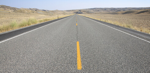 Highway in a wasteland, Wyoming, USA