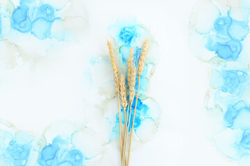 Obraz premium Creative image of beautiful wheat crops on artistic ink background. Top view with copy space. Symbols of jewish holiday - Shavuot