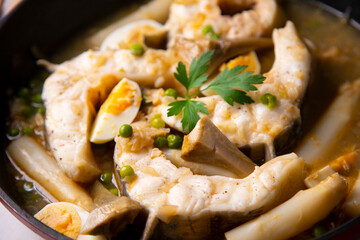 Conger eel with artichokes and white asparagus. Typical Spanish coast dish.