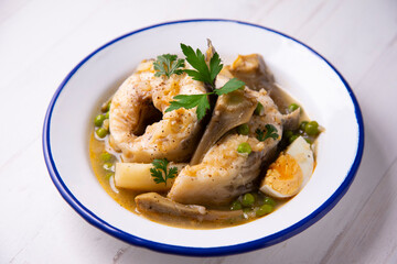 Conger eel with artichokes and white asparagus. Typical Spanish coast dish.