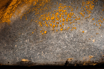 background wood flooring with remnants of orange old paint