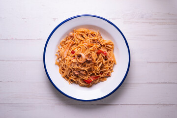 Paella with fideua and squid in a Spanish restaurant