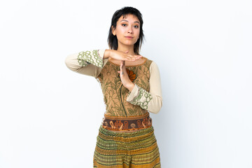 Young Uruguayan girl over isolated white background making time out gesture