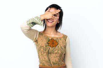 Young Uruguayan girl over isolated white background covering eyes by hands and smiling