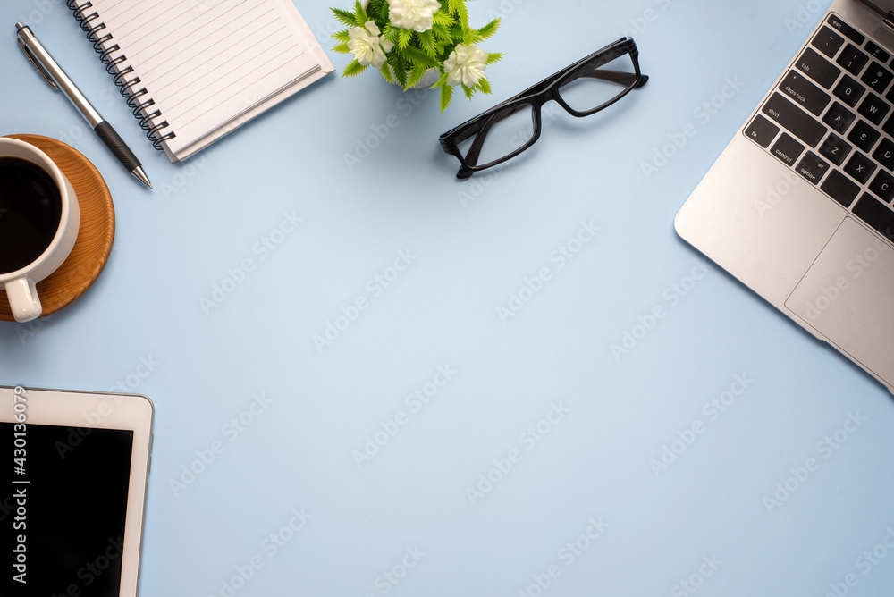Poster flat lay top view mockup image of working space ready working equipment pastel blue color background