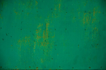 background metal surface with green paint and rust