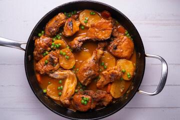 Chicken with potatoes and vegetables. Traditional tapa spanish recipe.